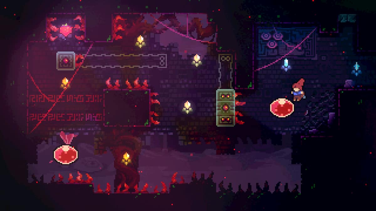 Madeline jumping into a red bubble in a dark room in Celeste