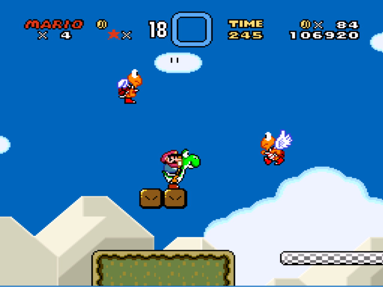 Mario riding Yoshi in Super Mario World with two flying koopas