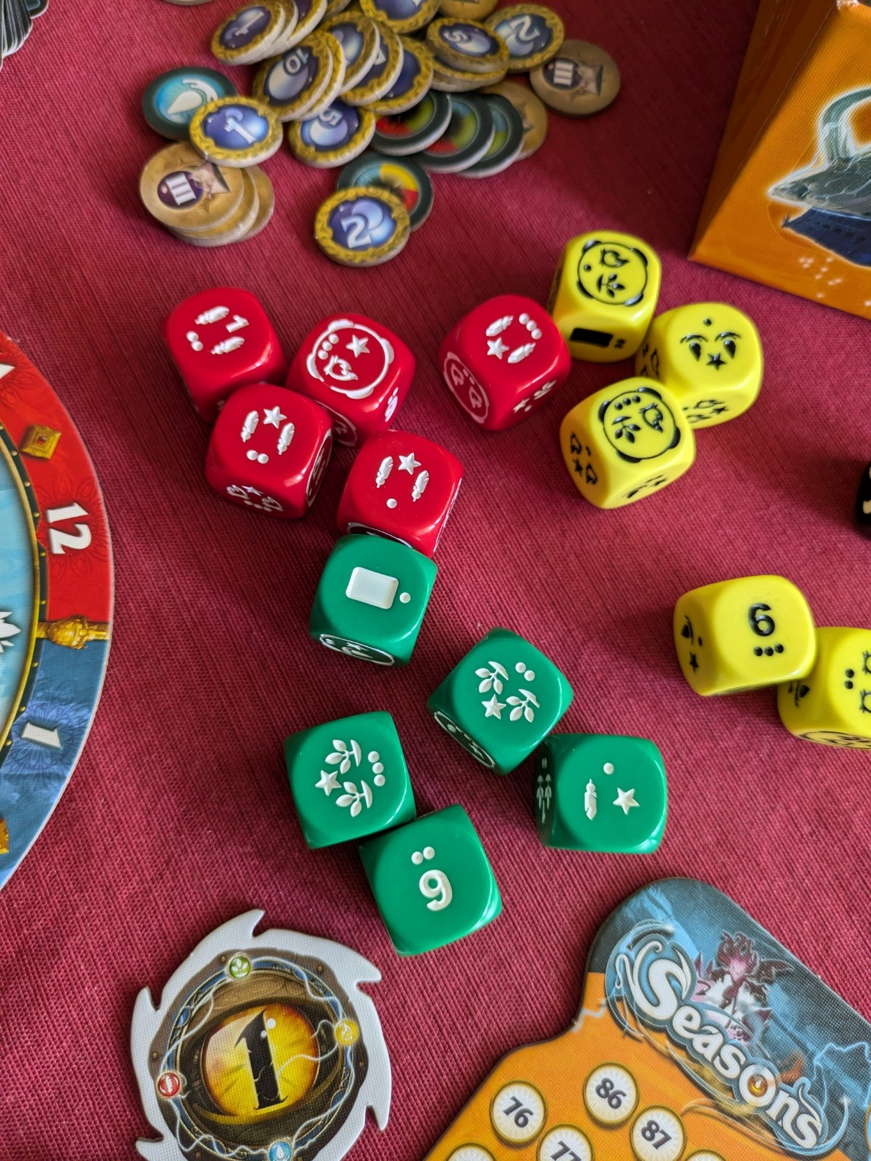 Close up of Seasons’ red, green and yellow dice