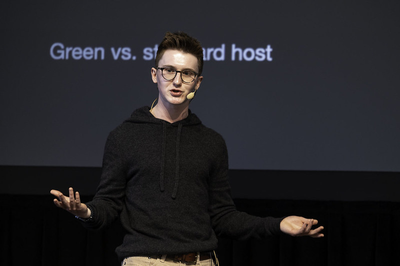 Ben speaking on a stage