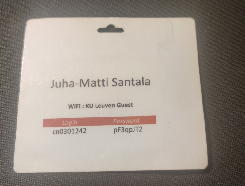 A conference badge backside with my name and wifi information for the event venue