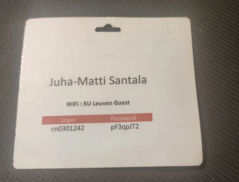 A conference badge backside with my name and wifi information for the event venue 