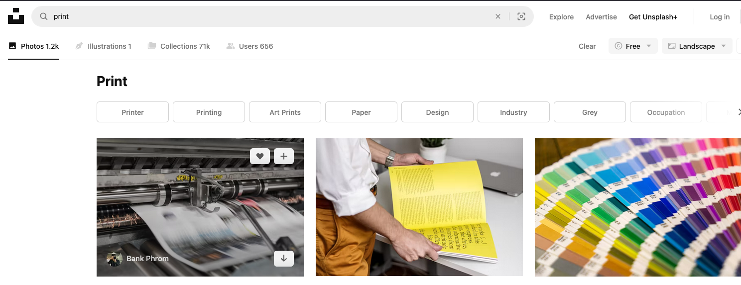 Screenshot from Unsplash website with query Print, showing three photos as search results. The first photo shows a newspaper printing machine printing a page which is blurred from motion. In the middle photo a person is holding a book that has yellow pages and black writing on them. In the final photo, there’s a fan of colour swatches in all colors of the rainbow.